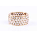 Van Cleef and Arpels; a diamond eternity ring in 18ct yellow gold, comprising four rows of round