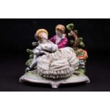 An 19th century Unterweissbach German porcelain 'lace' Arcadian figurine group, featuring a lady and