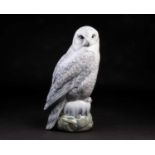 A large Royal Copenhagen model of a snowy owl, with printed and painted mark to base no 1829, 39.5cm