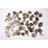 A collection of 46 assorted silver fobs and pendants, most with vacant cartouches, and some