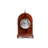 A George III period mahogany cased mantle clock with gilt surmount and pineapple finial. The