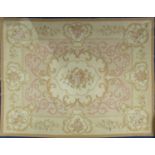 A large woven Aubusson style rug, 20th century, with central floral spray medallion framed by