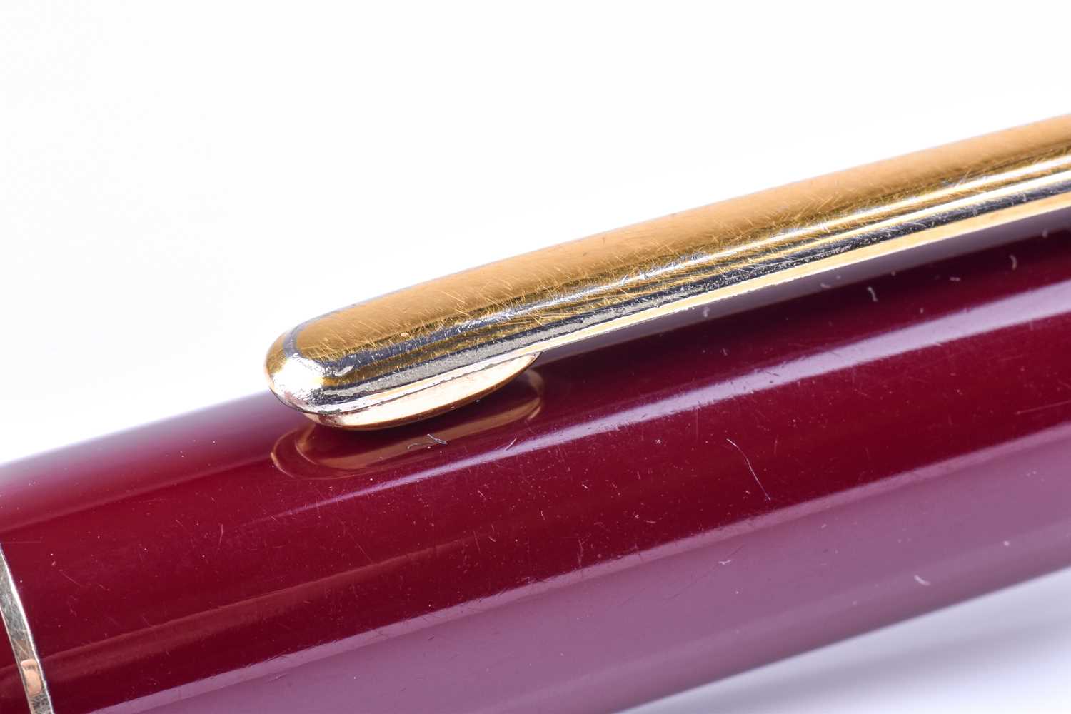 A Montblanc Meisterstuck ballpoint pen, with maroon coloured resin body and cap, and gilt metal - Image 2 of 7