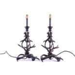 A pair of metalware table lamps, modelled as entwined deer antlers, 46 cm high to inlcude
