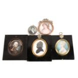 Four 19th century portrait miniatures on ivory, to include a naval officer in uniform, 8cm x 6.