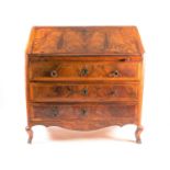 A Continental walnut veneered bureau, late 18th century, crossbanded and boxwood strung, with