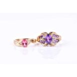 A yellow metal and amethyst dress ring the scrolled mount set with an oval-cut amethyst and lines of