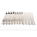 Arne Jacobsen for Georg Jensen, a set of sixteen stainless steel forks and eight knives, the