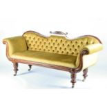An early Victorian scroll end sofa, circa 1840, with mahogany show frame, upholstered in mustard