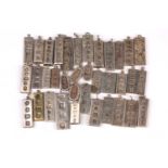 A group of thirty six various silver ingot pendants, some bearing engraved decoration and hallmarks,