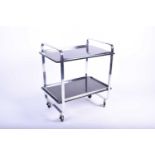 An Art Deco style chrome and lacquered two-tier drinks trolley, on four wheels, 72 cm high x 63 cm x