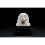 An Egyptian carved granite bust of a Pharoah, mounted on a metal rod and ebonised base, 19cm high