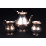 A Continental white metal three-piece teaset, marked 'Silver', comprising teapot, sucrier and