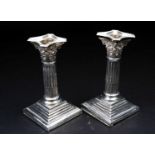 A pair of Victorian silver candlesticks, London 1896 by Charles Stuart Harris, of short Corinthian