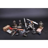 A collection of thirteen model airplane internal combustion engines, to include Frog, Bee, A-M, Fox,