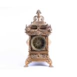 A large and elaborate Victorian brass mantel clock, the dial with Roman numerals and with eight