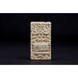 A small late 19th century Chinese carved ivory card case, the body decorated with figures and