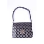A Louis Vuitton patent leather damier handbag, with textured material, bearing square plaque '