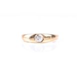 A single stone diamond ring, the brilliant cut diamond flush set within a tapering band, Size R, 6.