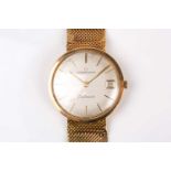 An Eterna-matic Centenaire 9ct yellow gold wristwatch, the silvered dial with slim baton indices and