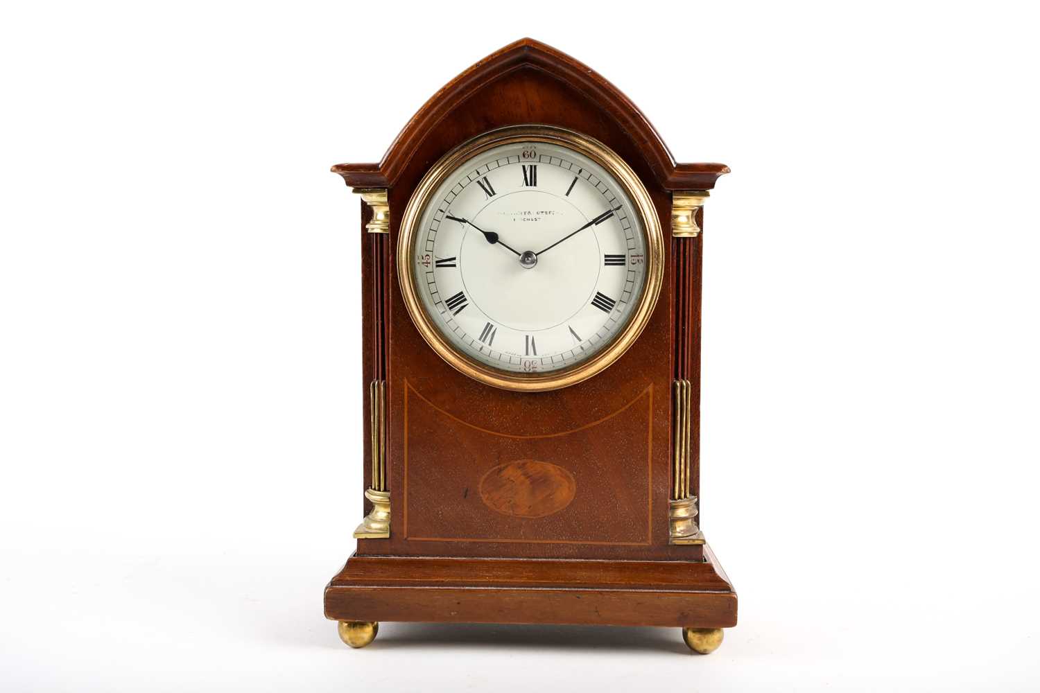 An Edwardian mahogany and inlaid mantel clock, with french eight day movement, the enamel dial