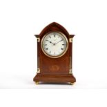 An Edwardian mahogany and inlaid mantel clock, with french eight day movement, the enamel dial