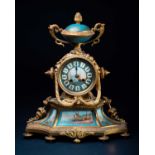 A 19th century French gilt clock, with Paris porcelain panels painted with Italianate coastal/