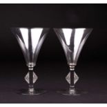 René Lalique: a pair of Art Deco Saverne pattern wine or cocktail glasses, the square stems with