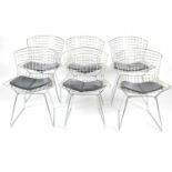 A set of six chrome plated Harry Bartoia style chairs, of meshed wire design, with seat pads.