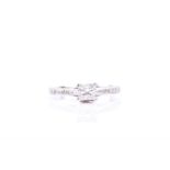 A platinum and diamond ring set with a princess-cut diamond of approximately 0.33 carats, the