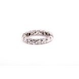 A diamond eternity ring, set with seventeen round brilliant-cut diamonds of approximately 2.70