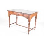 A late Victorian writing table, circa 1890, the rectangular top with moulded edge, a single drawer