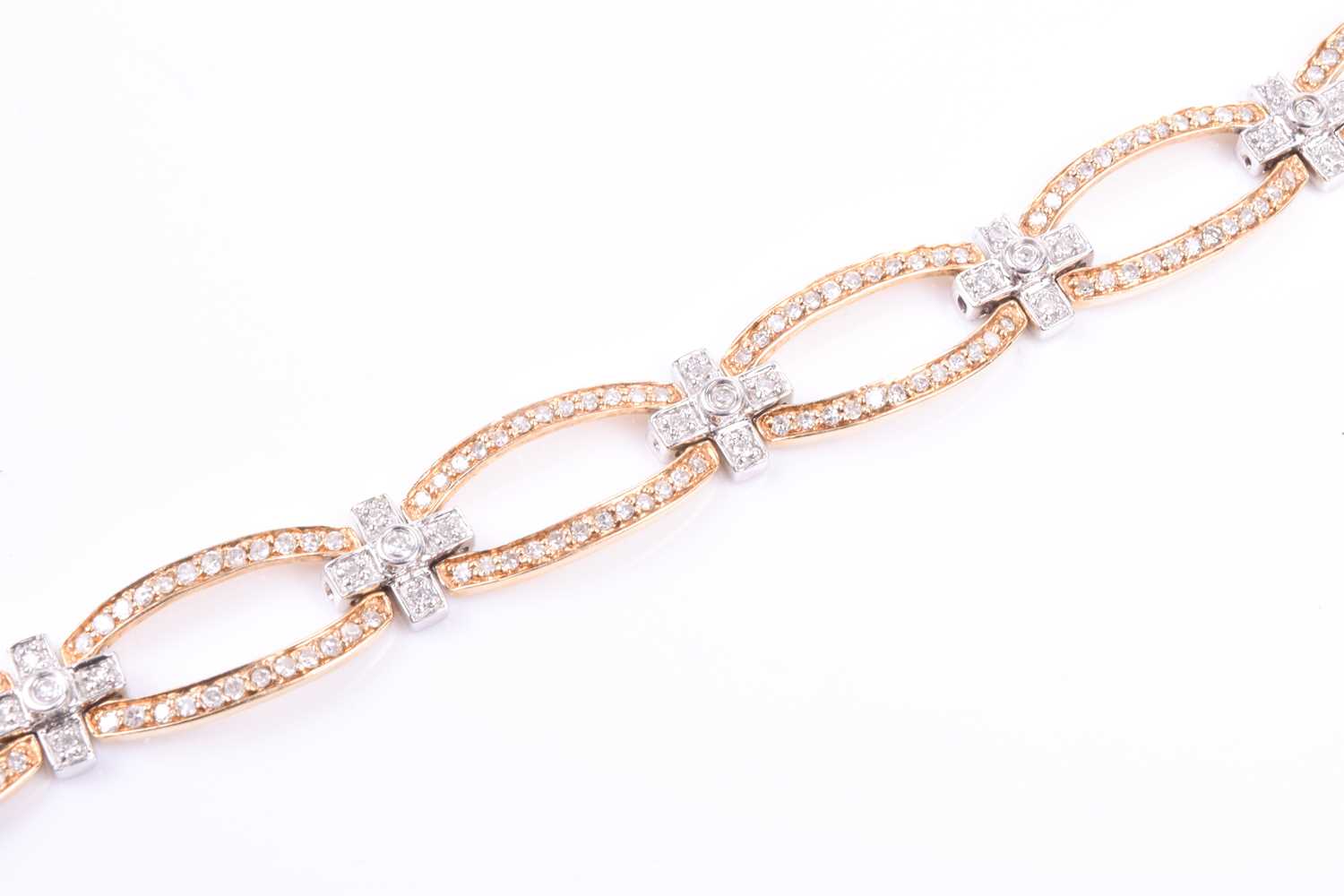 A 14ct yellow and white gold and diamond bracelet, comprised of openwork oval and square segments, - Image 3 of 5