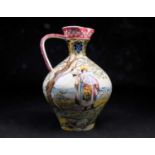 An early 20th century Fischer Budapest ceramic ewer / water pitcher, the body decorated inpolychrome