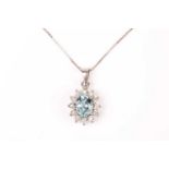 A diamond and aquamarine pendant, set with a mixed oval-cut aquamarine of approximately 2.0