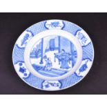 A Chinese blue & white plate, painted with an interior scene of a scholar and attendant, the