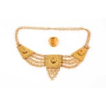 An unusual gilt metal chain-link and filigree bib necklace, with stylised detail to three panels,