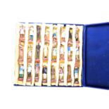 a boxed collection of painted plaster Indian miniature figures, representing all levels of