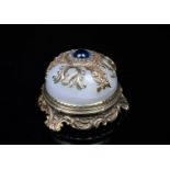 A Russian silver gilt bell push, set with diamonds framing a blue stone button with silver gilt