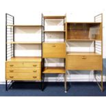 A 1970s teak Staples Ladderax modular wall unit, with shelves, glass sliding door bookcase, drawer