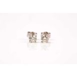 A pair of 18ct white gold and diamond solitaire earrings, the diamonds of approximately 1.0 carats