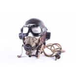 A WWII era leather 'C' type flying helmet and related equipment, to include built-in ear phones,