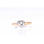 A single stone heart-shaped diamond ring; the heart-shaped brilliant cut diamond in rubover mount to