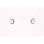 A pair of diamond and pearl cluster earrings, each set with a South Sea pearl approximately 11 mm
