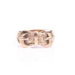 A 9ct yellow gold gents ring, of double buckle design, with engraved decoration, hallmarked to