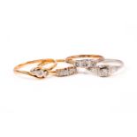 An 18ct yellow gold and diamond accent crossover ring, size O, together with another 18ct ring set