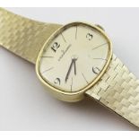 Armbanduhr "Eterna-Matic".Querovales Medium-Gehäuse und fest angesetztes Milanaiseband 585/000 GG,