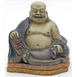 Glücksbuddha "Hotei".Lack, farbig gefasst. Min. best. Auf Sockel mit Seidenbrokat. H. 13,5 cm.