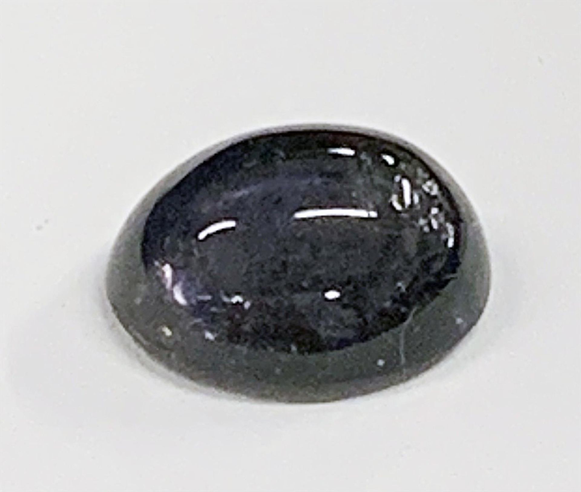 Iolith, 4,86 ct.Ovales Cabochon.