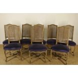 A set of 8 white wash Louis XVI-style chairs with purple velvet lining